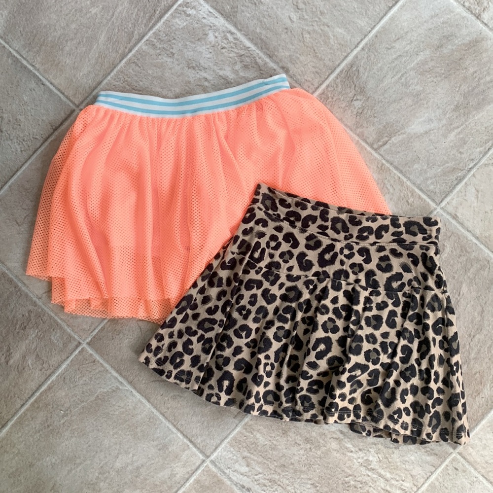 2 skirts with shorts. Size 7.